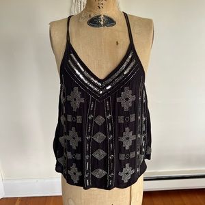 All about her l, black dressy boutique tank top with embellishments.